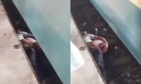 Vader duikt onder trein om kind te redden en overleeft het allebei