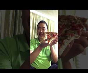 Man Eats An Entire Slice Of Pizza In One Bite